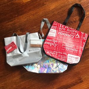 Assorted lululemon and Athleta bags